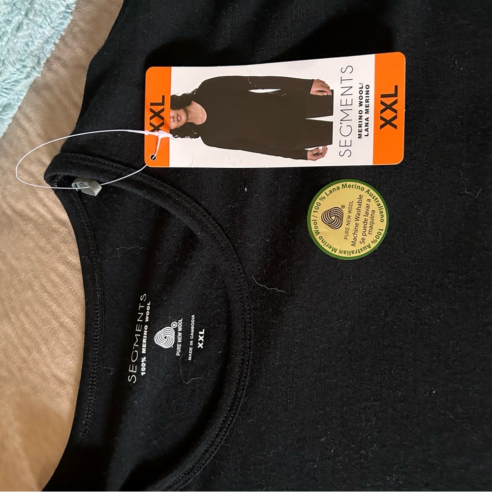 Black long sleeve shirt/never been worn.